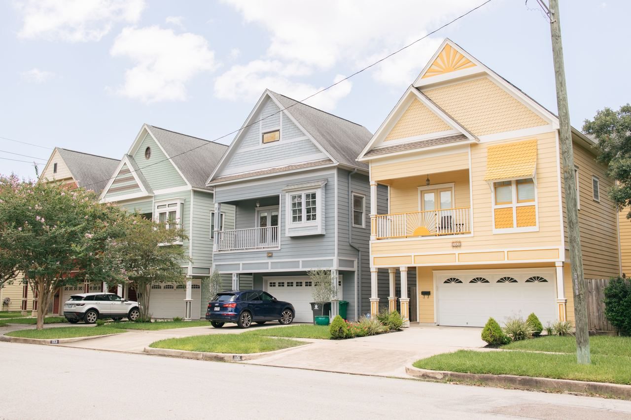 Houses along a Houston Heights street; regional housing context, not a photographed job or the named community