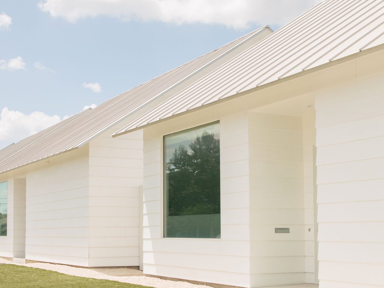 Modern white house photographed in Houston, Texas; representative regional residence, not a mold-removal job